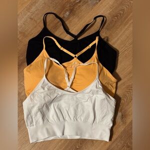 Set of Three XL sports bras in Black, Orange, and White **2 fo 20**